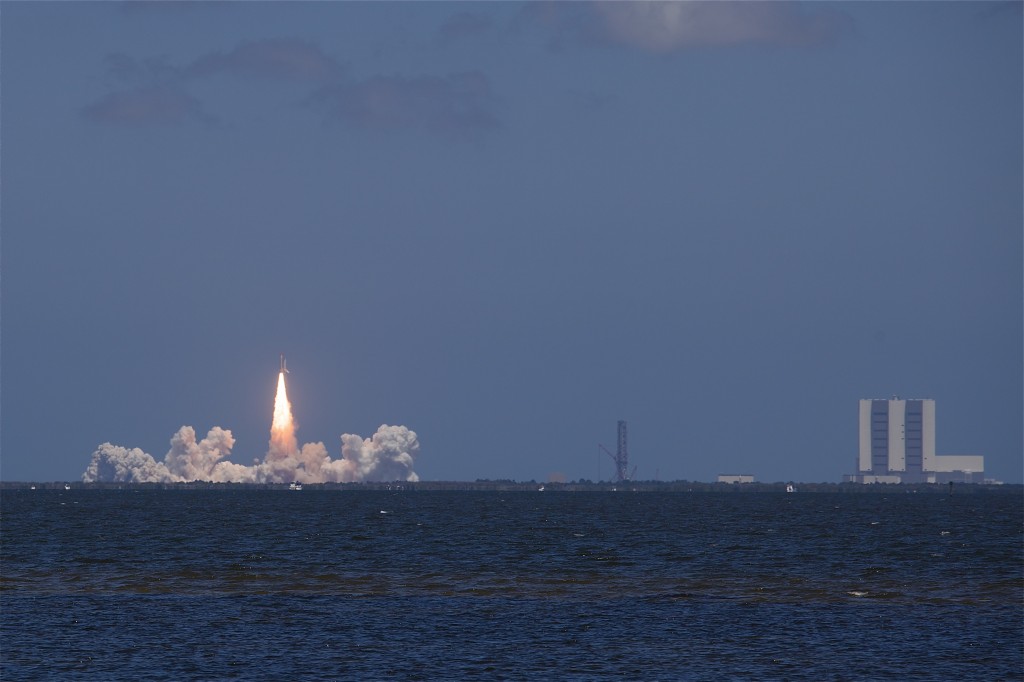 "liftoff of space shuttle Atlantis, reaching the crest of its historic achievements in space"